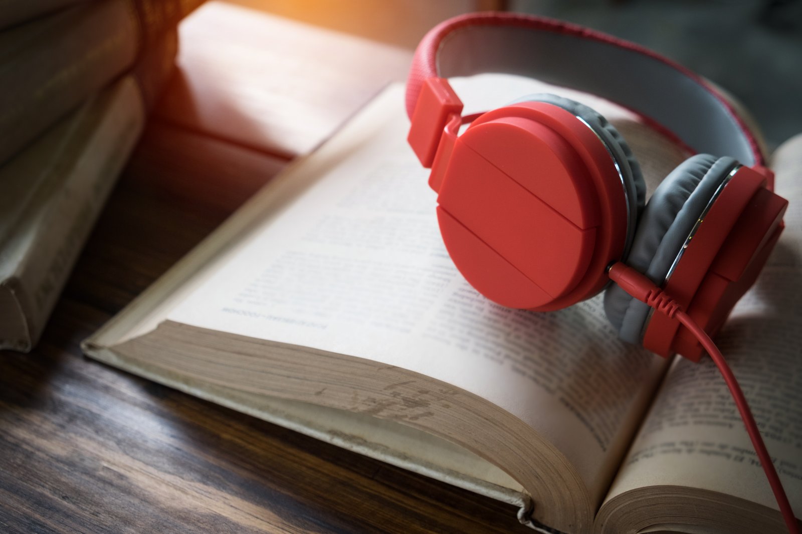 concept audiobook books table with headphones put them
